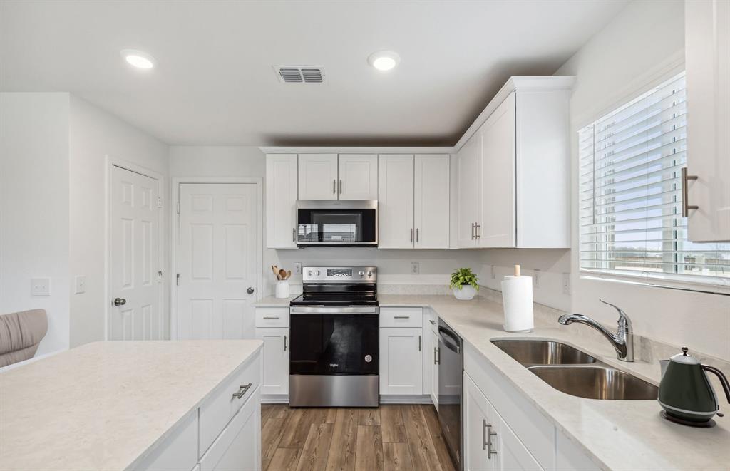 7502 Fenton Parkway Pilot Point, TX 76258 - Photo 2 of 10 Abundant cabinet space in kitchen *Model Representation*