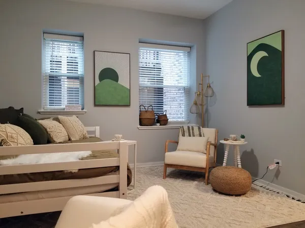 a living room with furniture and a window