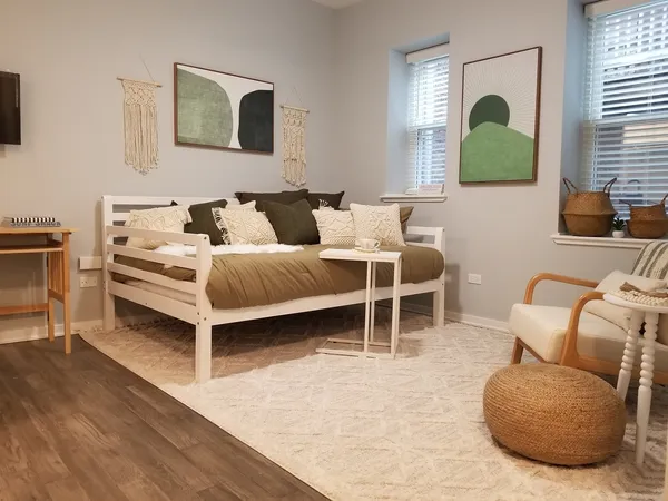 a bedroom with furniture and a window