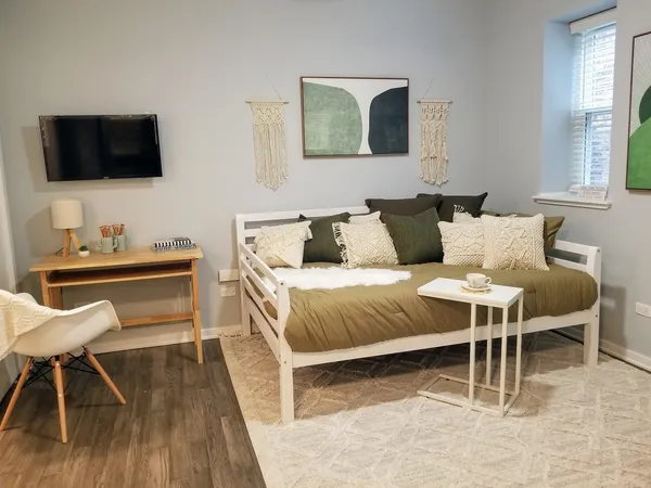 a living room with a couch and a flat screen tv