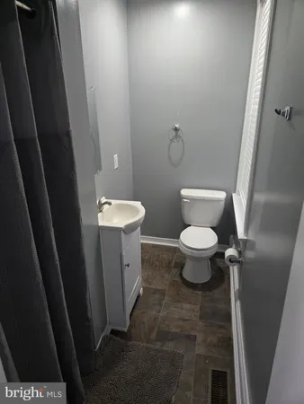 a bathroom with a toilet and a sink