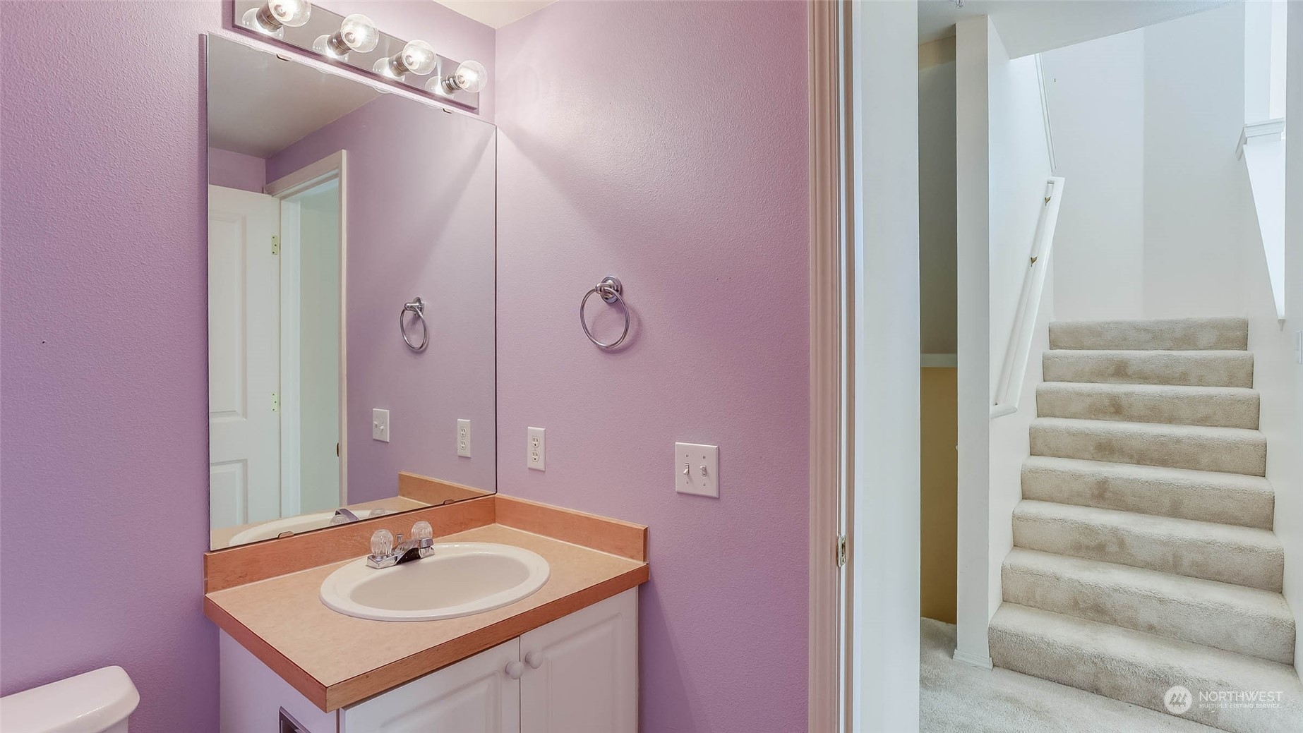 2300 Benson Road South, Unit G1 Renton, WA 98055 - Photo 18 of 36 a bathroom with a sink and a mirror with toilet