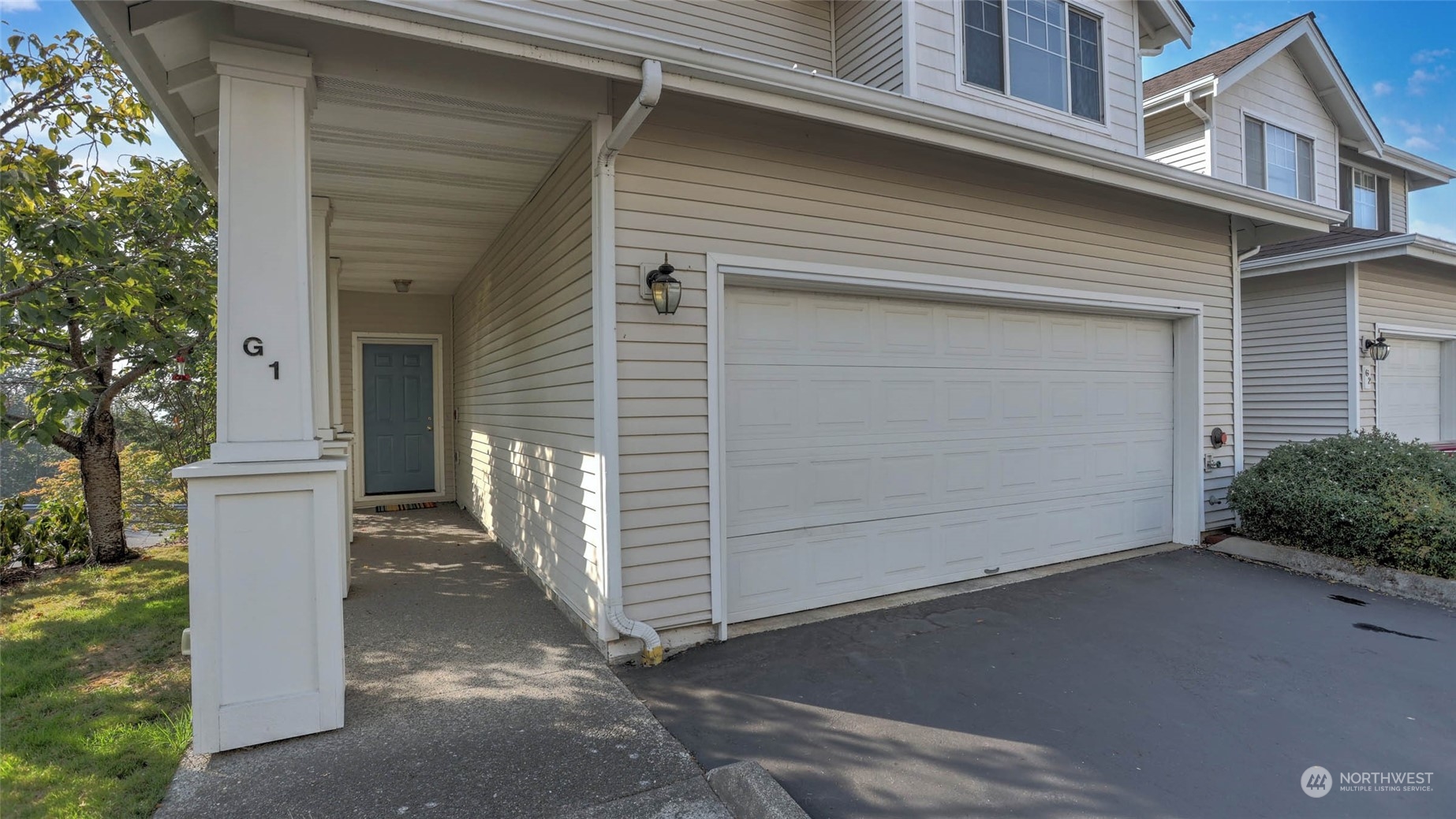 2300 Benson Road South, Unit G1 Renton, WA 98055 - Photo 5 of 36 a view of a house with a garage