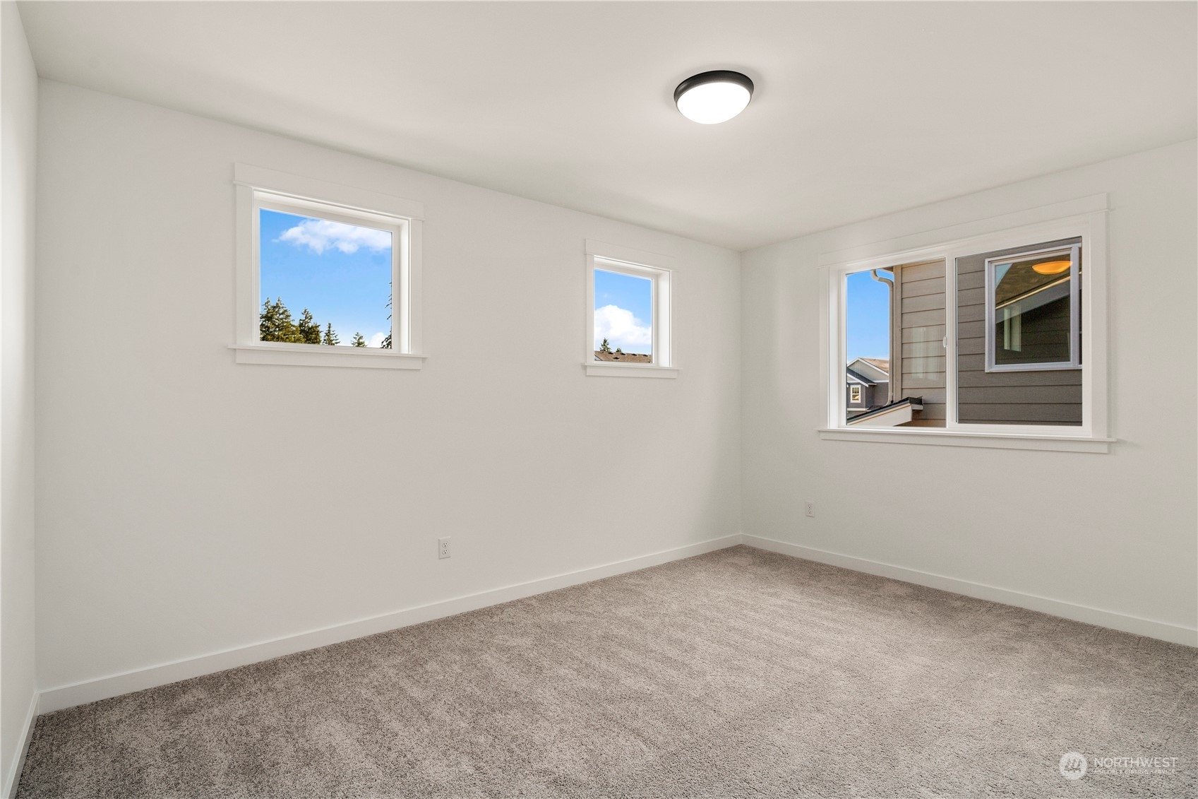 19 179th Place Southwest Bothell, WA 98012 - Photo 26 of 29 an empty room with windows and closet