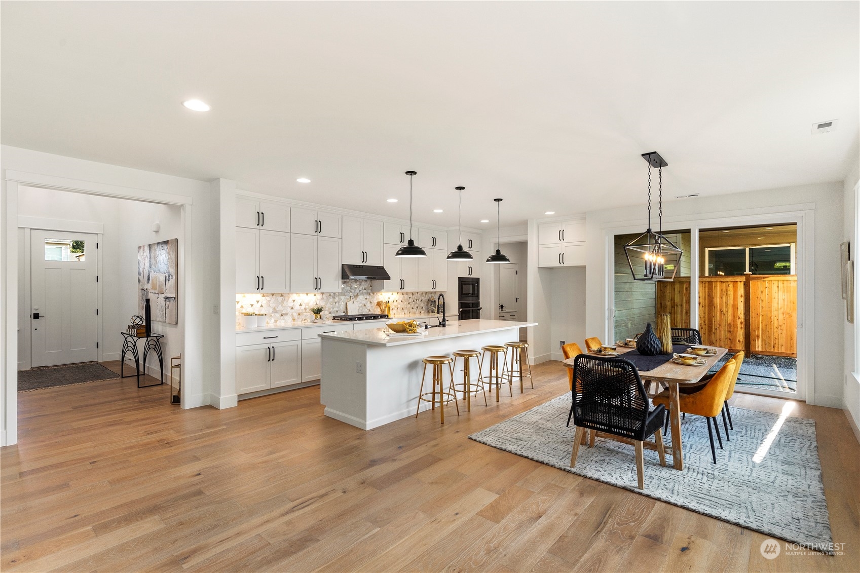 19 179th Place Southwest Bothell, WA 98012 - Photo 7 of 29 a open kitchen with white cabinets and stainless steel appliances