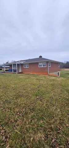 a view of a large building with a big yard
