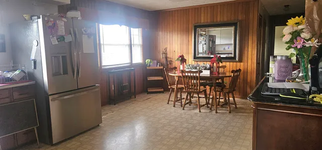 a dining room with furniture and window