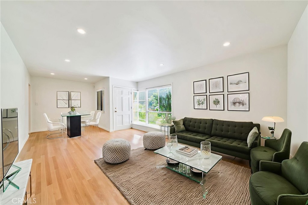 5729 Clemson Street Los Angeles, CA 90016 - Photo 4 of 26 a living room with furniture or couch and a wooden floor