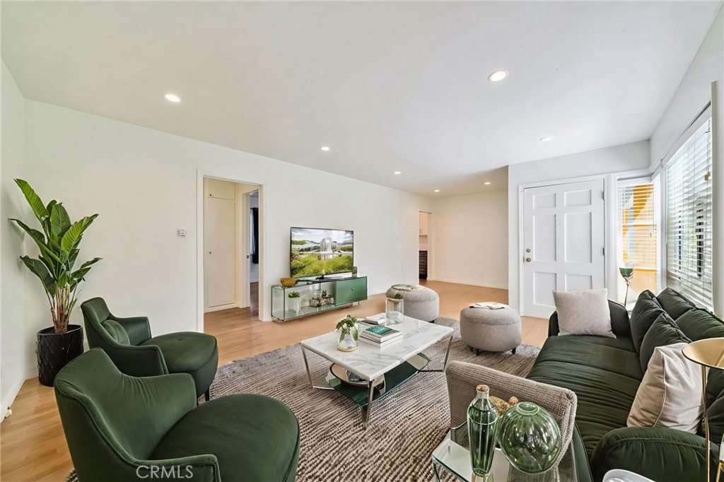 5729 Clemson Street Los Angeles, CA 90016 - Photo 5 of 26 a living room with furniture potted plant and a window