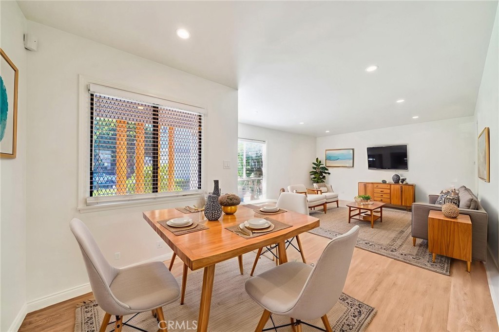 5729 Clemson Street Los Angeles, CA 90016 - Photo 6 of 26 a view of a dining room with furniture and wooden floor