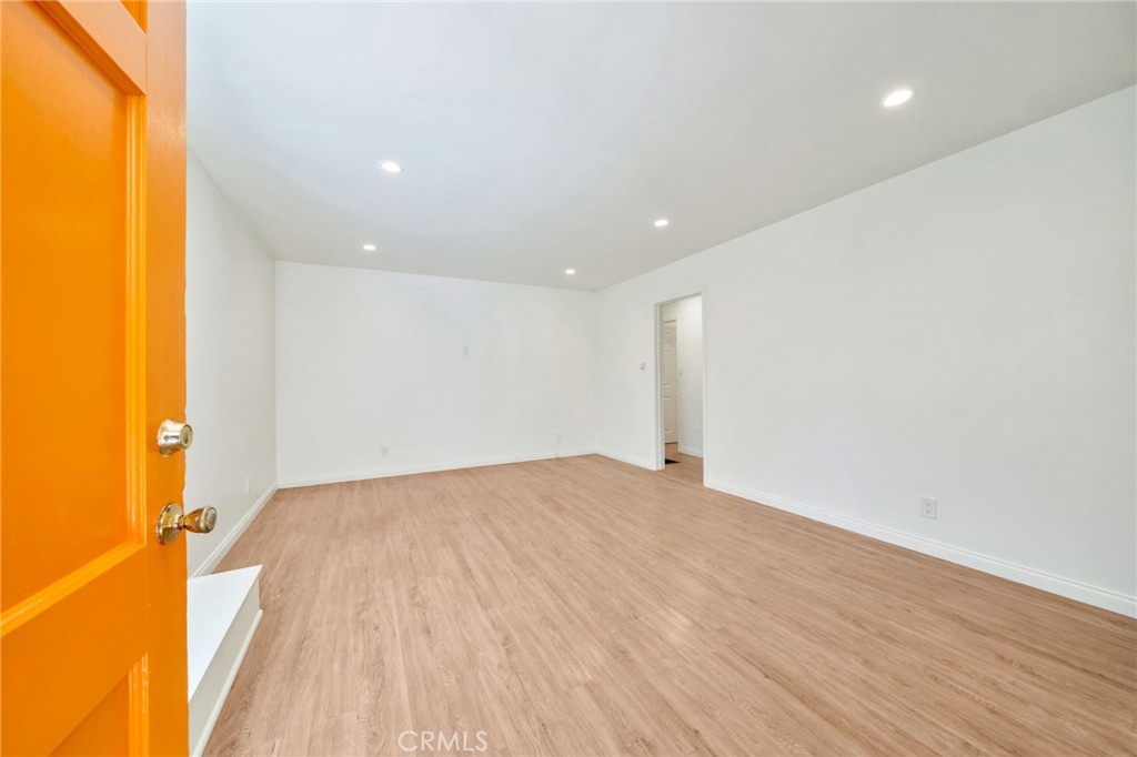 5729 Clemson Street Los Angeles, CA 90016 - Photo 10 of 26 a view of empty room with wooden floor and fan