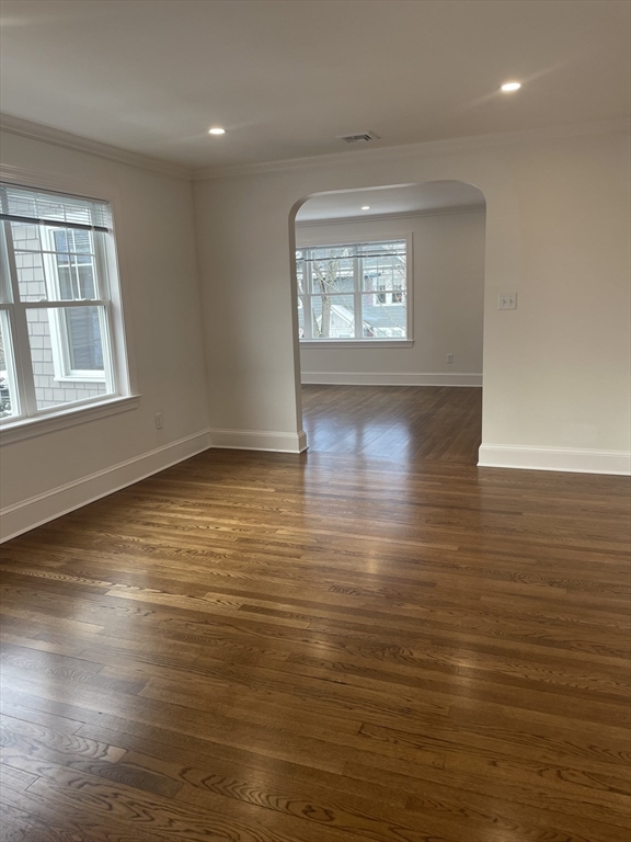 29 Crescent Road, Unit 29 Belmont, MA 02478 - Photo 5 of 21 an empty room with wooden floor and windows