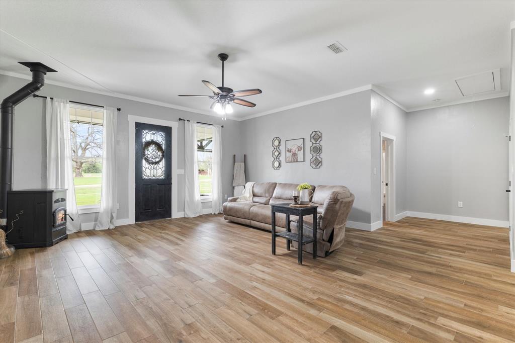 5480 New Hope Road Aubrey, TX 76227 - Photo 12 of 39 a view of a livingroom with furniture and wooden floor