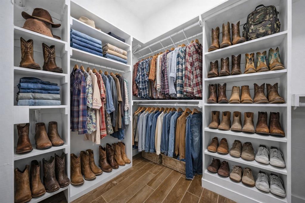 5480 New Hope Road Aubrey, TX 76227 - Photo 16 of 39 a view of walk in closet with clothes and shoes
