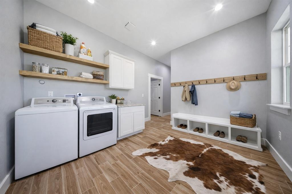 5480 New Hope Road Aubrey, TX 76227 - Photo 25 of 39 a kitchen with a stove top oven and cabinets
