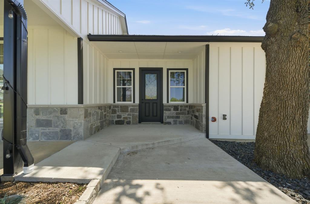 5480 New Hope Road Aubrey, TX 76227 - Photo 27 of 39 a front view of a house with a yard
