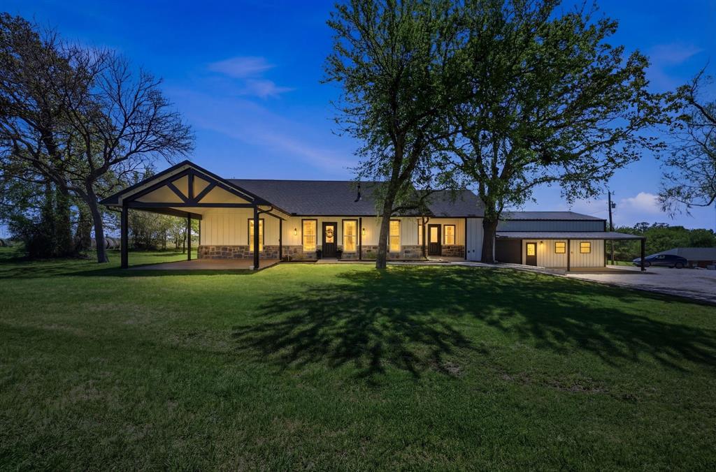5480 New Hope Road Aubrey, TX 76227 - Photo 29 of 39 a front view of a house with a yard