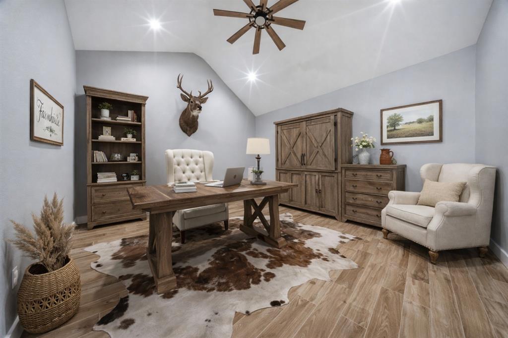 5480 New Hope Road Aubrey, TX 76227 - Photo 30 of 39 a living room with furniture and a wooden floor