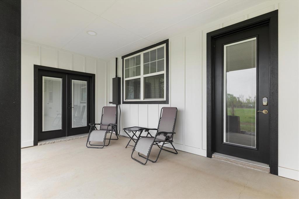 5480 New Hope Road Aubrey, TX 76227 - Photo 29 of 39 a view of an empty room with furniture and a window