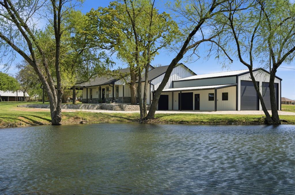 5480 New Hope Road Aubrey, TX 76227 - Photo 3 of 39 a view of a house with a swimming pool