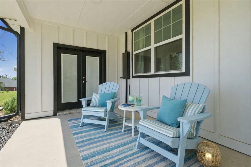 5480 New Hope Road Aubrey, TX 76227 - Photo 33 of 39 a living room with furniture and a window