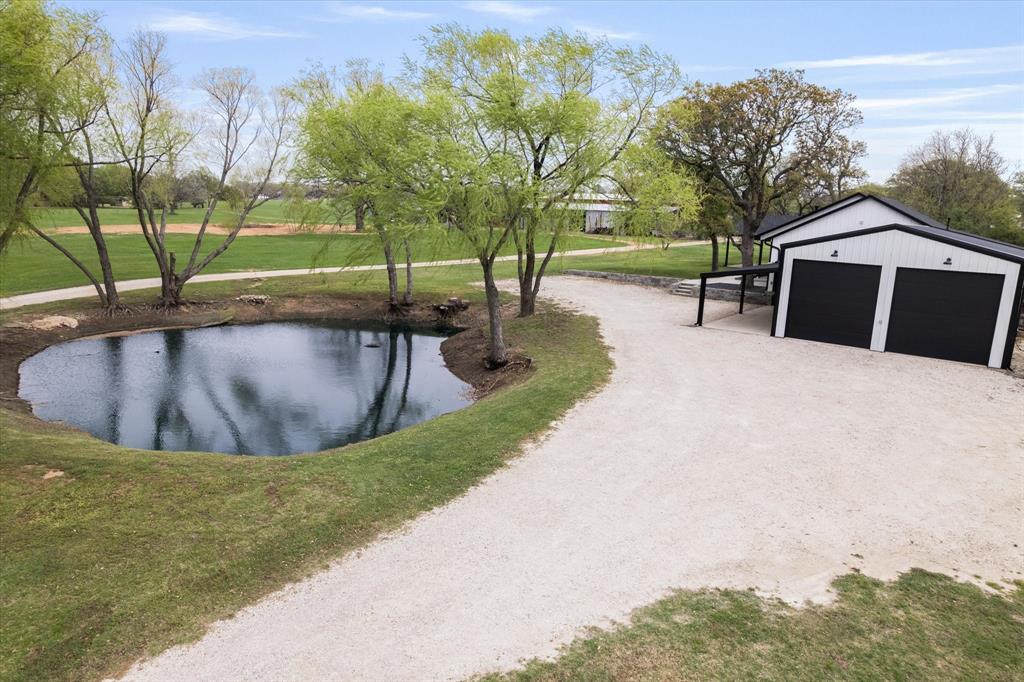 5480 New Hope Road Aubrey, TX 76227 - Photo 38 of 39 a view of a swimming pool with a patio