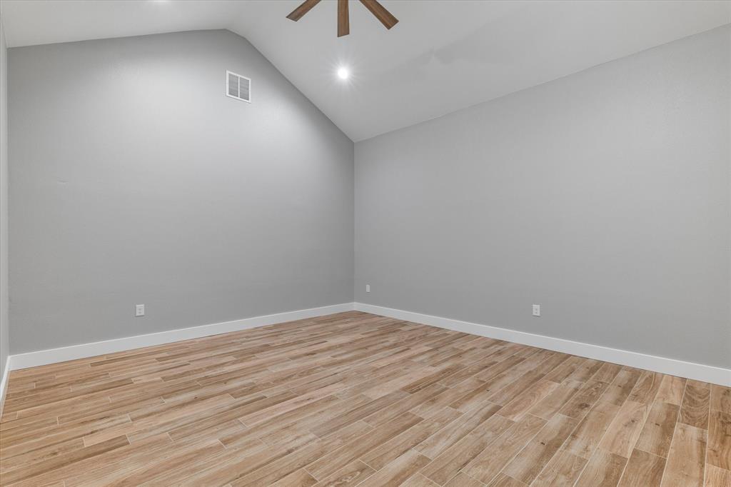 5480 New Hope Road Aubrey, TX 76227 - Photo 4 of 39 wooden floor in an empty room