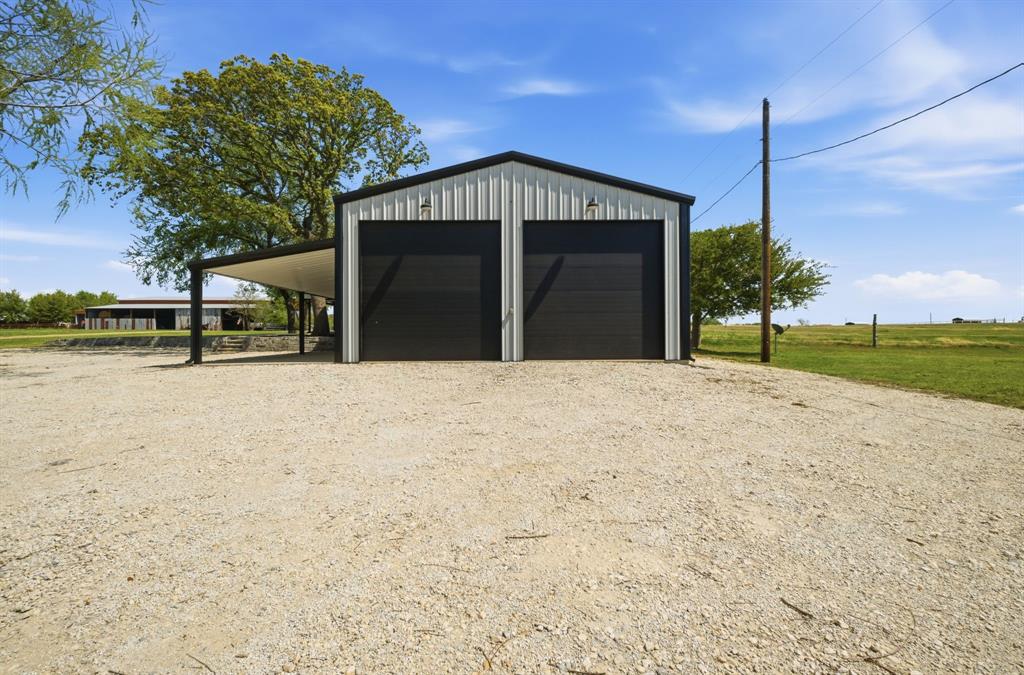 5480 New Hope Road Aubrey, TX 76227 - Photo 7 of 39 a view of a house with a yard