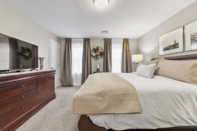 a living room with a couch and a flat screen tv