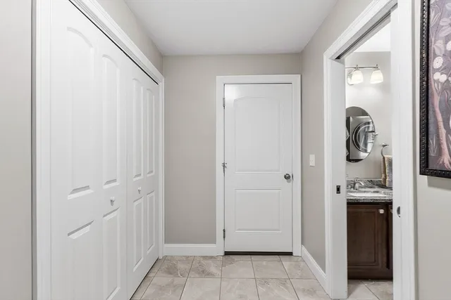 a view of a kitchen from the hallway