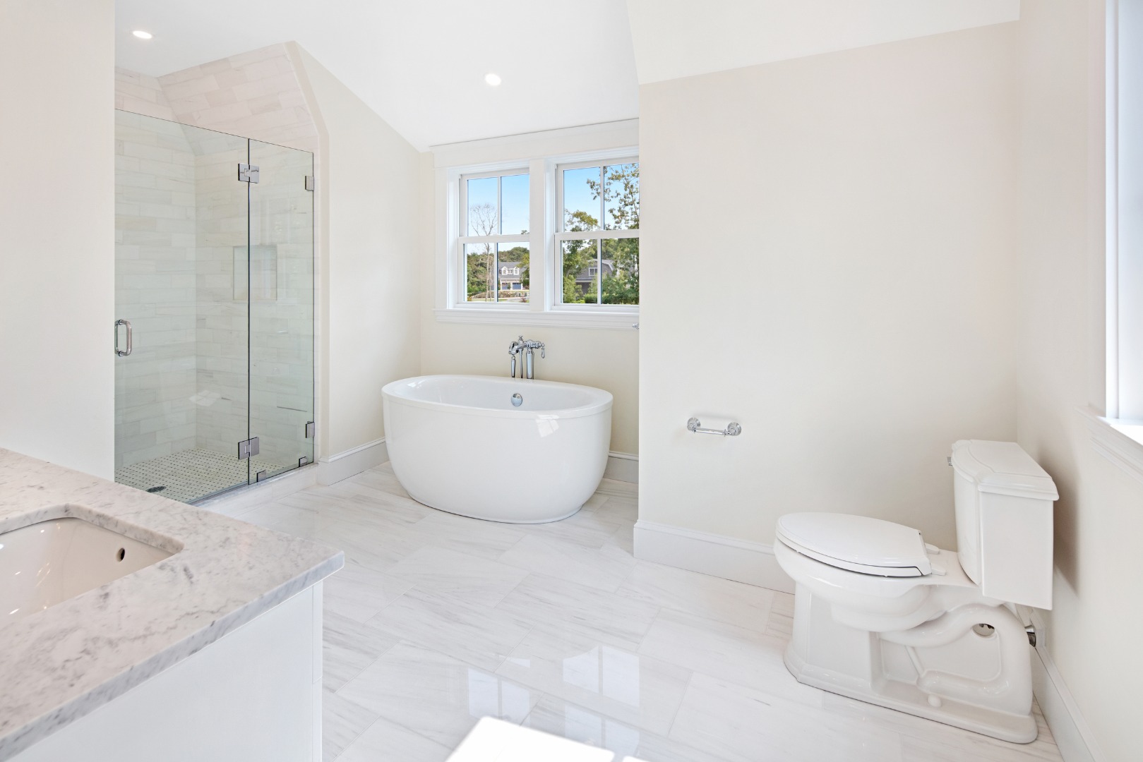 1 Wilsons Lane Edgartown, MA 02539 - Photo 15 of 18 a spacious bathroom with a granite countertop sink a toilet and a bathtub