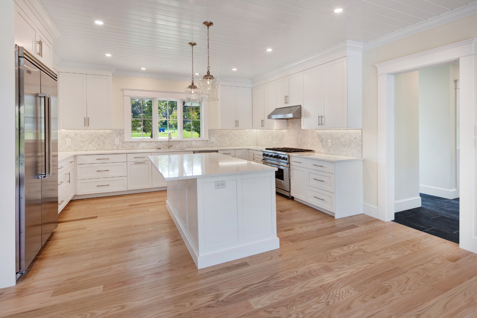 1 Wilsons Lane Edgartown, MA 02539 - Photo 2 of 18 a kitchen with stainless steel appliances granite countertop a sink stove and refrigerator