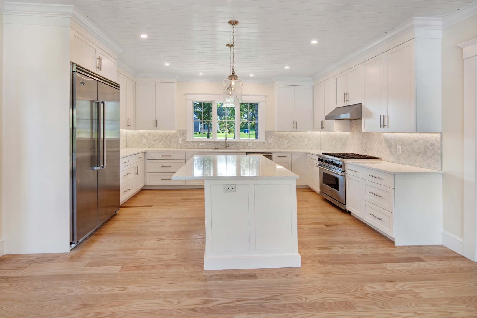 1 Wilsons Lane Edgartown, MA 02539 - Photo 3 of 18 a large kitchen with stainless steel appliances granite countertop a stove top oven and a refrigerator