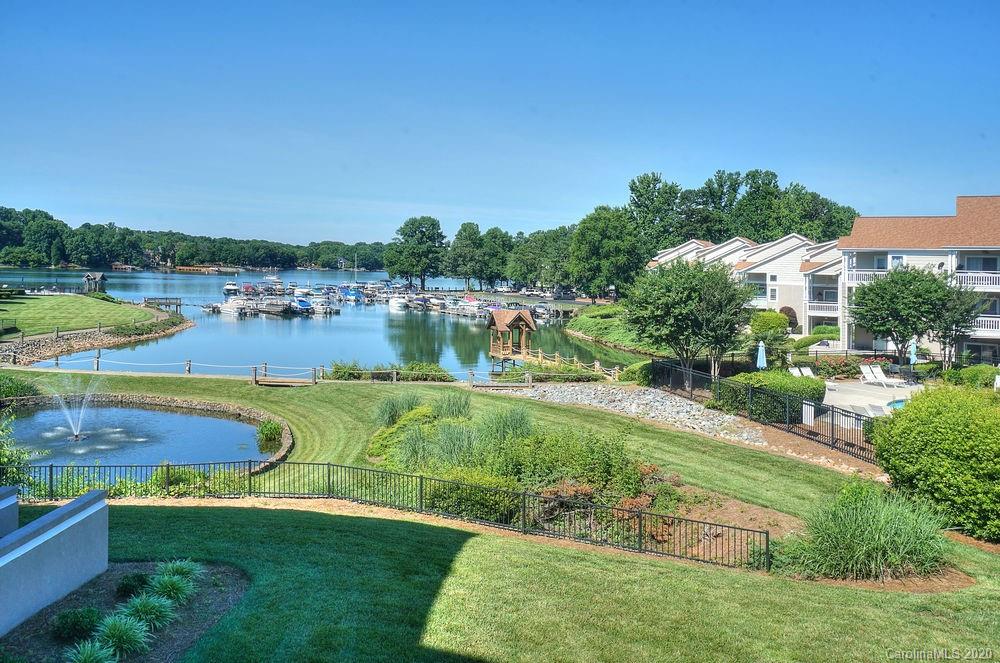 1114 Torrence Circle, Unit 1114 Davidson, NC 28036 - Photo 26 of 29 a view of a lake with houses in the back