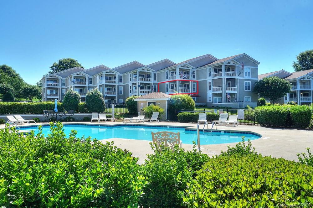 1114 Torrence Circle, Unit 1114 Davidson, NC 28036 - Photo 27 of 29 a view of a house with swimming pool
