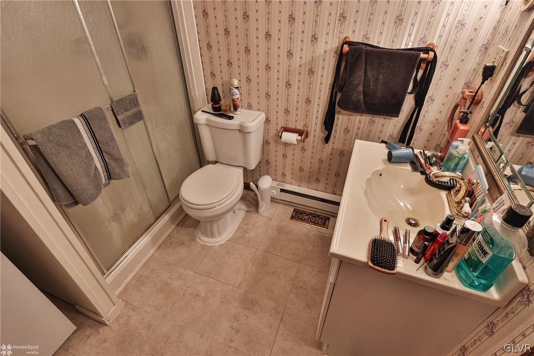 292 East Moorestown Road Wind Gap, PA 18091 - Photo 11 of 46 a white toilet sitting next to a small bathroom