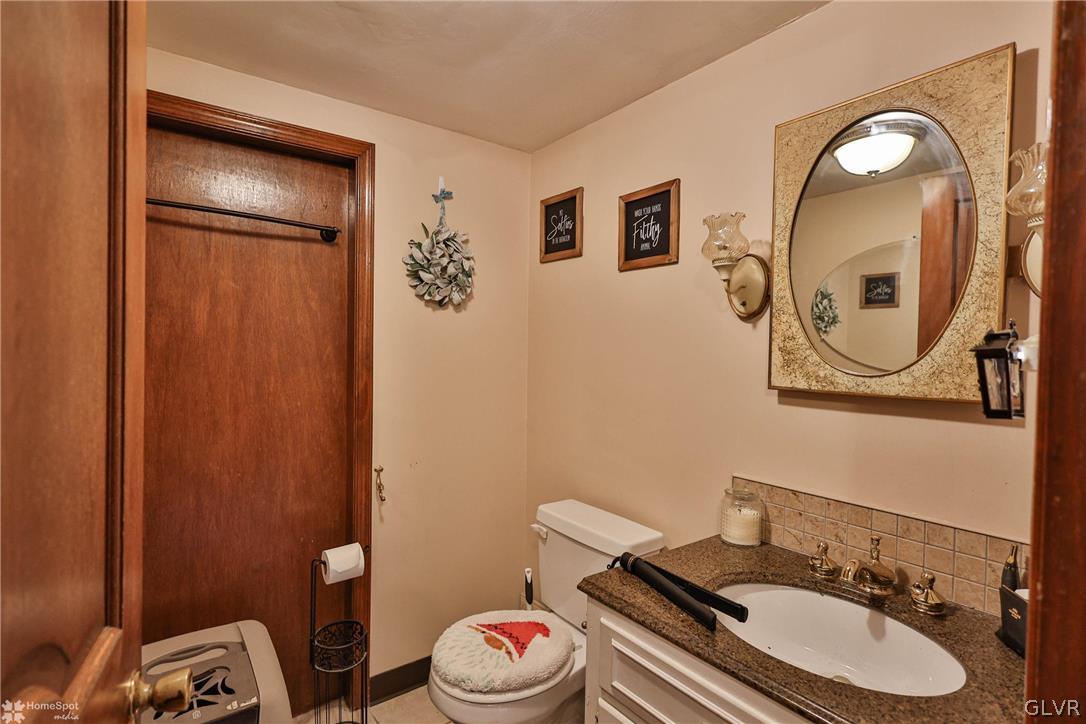 292 East Moorestown Road Wind Gap, PA 18091 - Photo 15 of 46 a bathroom with a sink mirror vanity and toilet