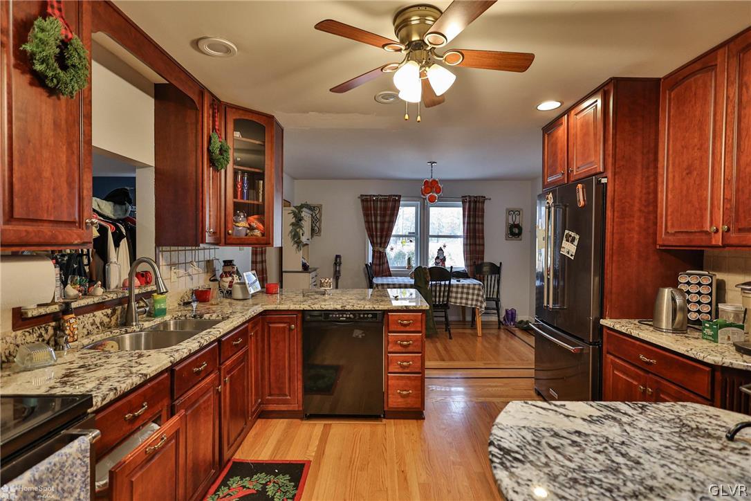 292 East Moorestown Road Wind Gap, PA 18091 - Photo 21 of 46 a kitchen with stainless steel appliances granite countertop sink stove refrigerator dining table and chairs