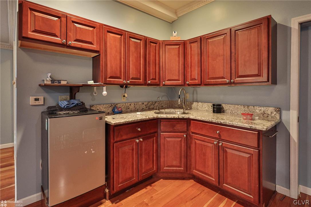 292 East Moorestown Road Wind Gap, PA 18091 - Photo 28 of 46 a kitchen with stainless steel appliances granite countertop wooden cabinets a sink and dishwasher