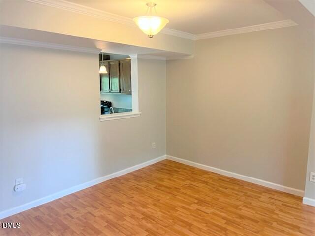4507 Still Pines Drive Raleigh, NC 27613 - Photo 11 of 27 an empty room with wooden floor and windows