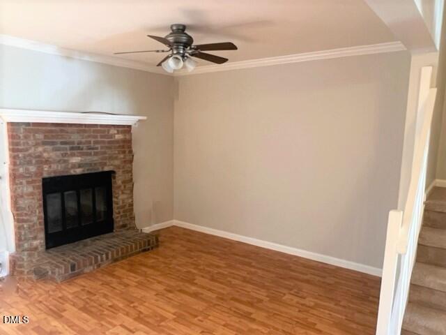 4507 Still Pines Drive Raleigh, NC 27613 - Photo 13 of 27 a view of empty room with wooden floor and a fireplace