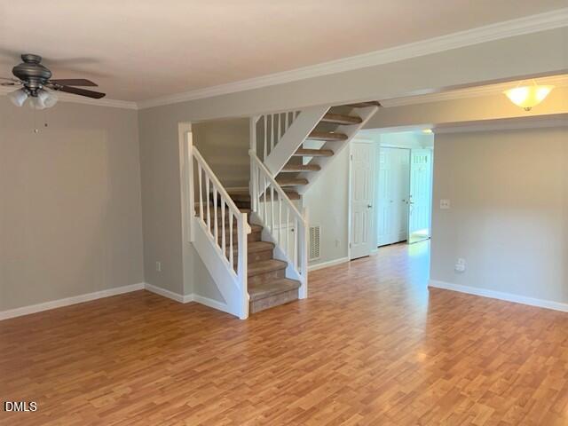4507 Still Pines Drive Raleigh, NC 27613 - Photo 14 of 27 a view of entryway with stairs and wooden floor