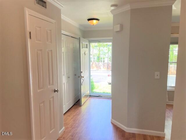 4507 Still Pines Drive Raleigh, NC 27613 - Photo 16 of 27 a view of a hallway with wooden floor and closet