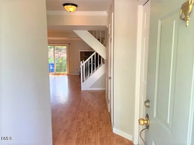 a view of entryway with wooden floor