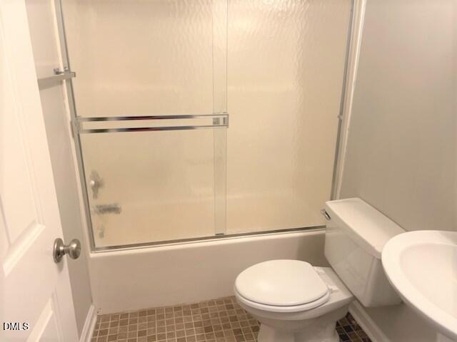 4507 Still Pines Drive Raleigh, NC 27613 - Photo 24 of 27 a white toilet sitting next to a shower