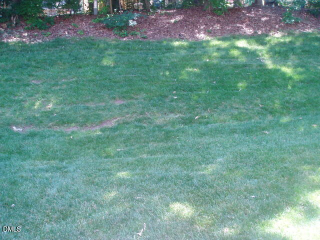 4507 Still Pines Drive Raleigh, NC 27613 - Photo 27 of 27 a view of a house with a yard