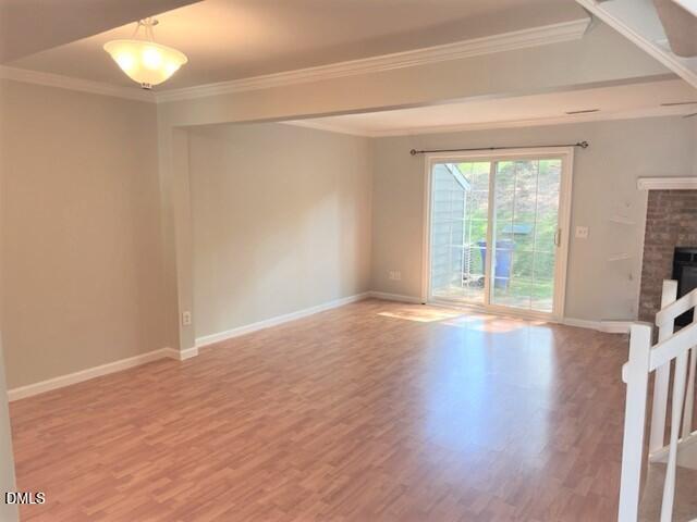 4507 Still Pines Drive Raleigh, NC 27613 - Photo 3 of 27 wooden floor in an empty room with a window