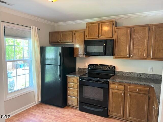 4507 Still Pines Drive Raleigh, NC 27613 - Photo 4 of 27 a kitchen with a refrigerator stove and microwave