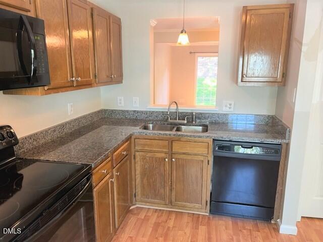 4507 Still Pines Drive Raleigh, NC 27613 - Photo 7 of 27 a kitchen with stainless steel appliances granite countertop a sink stove and cabinets