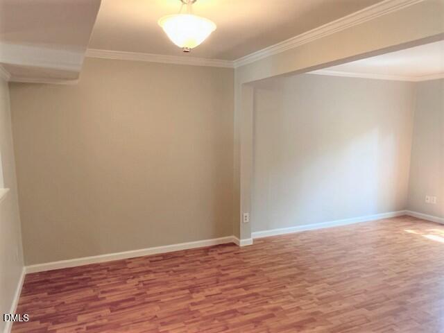 4507 Still Pines Drive Raleigh, NC 27613 - Photo 10 of 27 a view of an empty room with wooden floor
